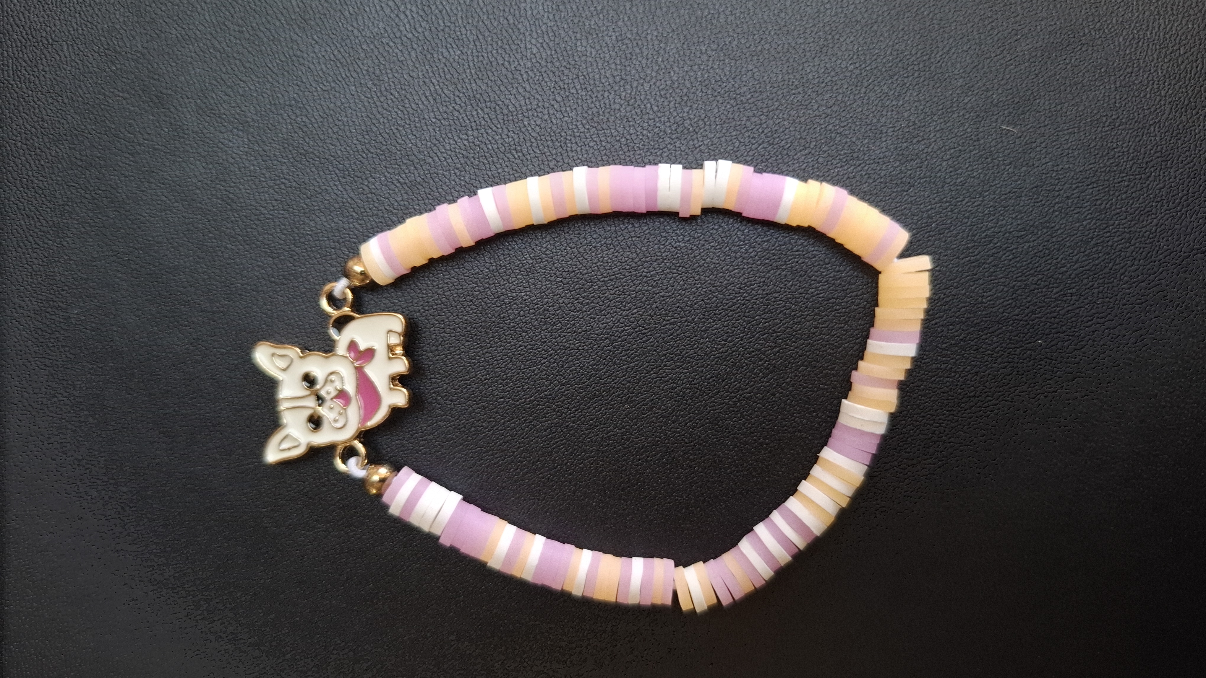 armbandje oranje/paars/wit met wit hondje